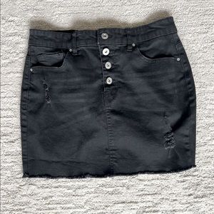 True Craft black semi-destructed mini Jean Skirt with button front in the size 9